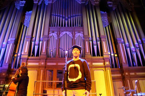 Repping Delta in front of the grandiose pipe organ of ADL Town Hall (Steve checks Zoe's dbl bass)